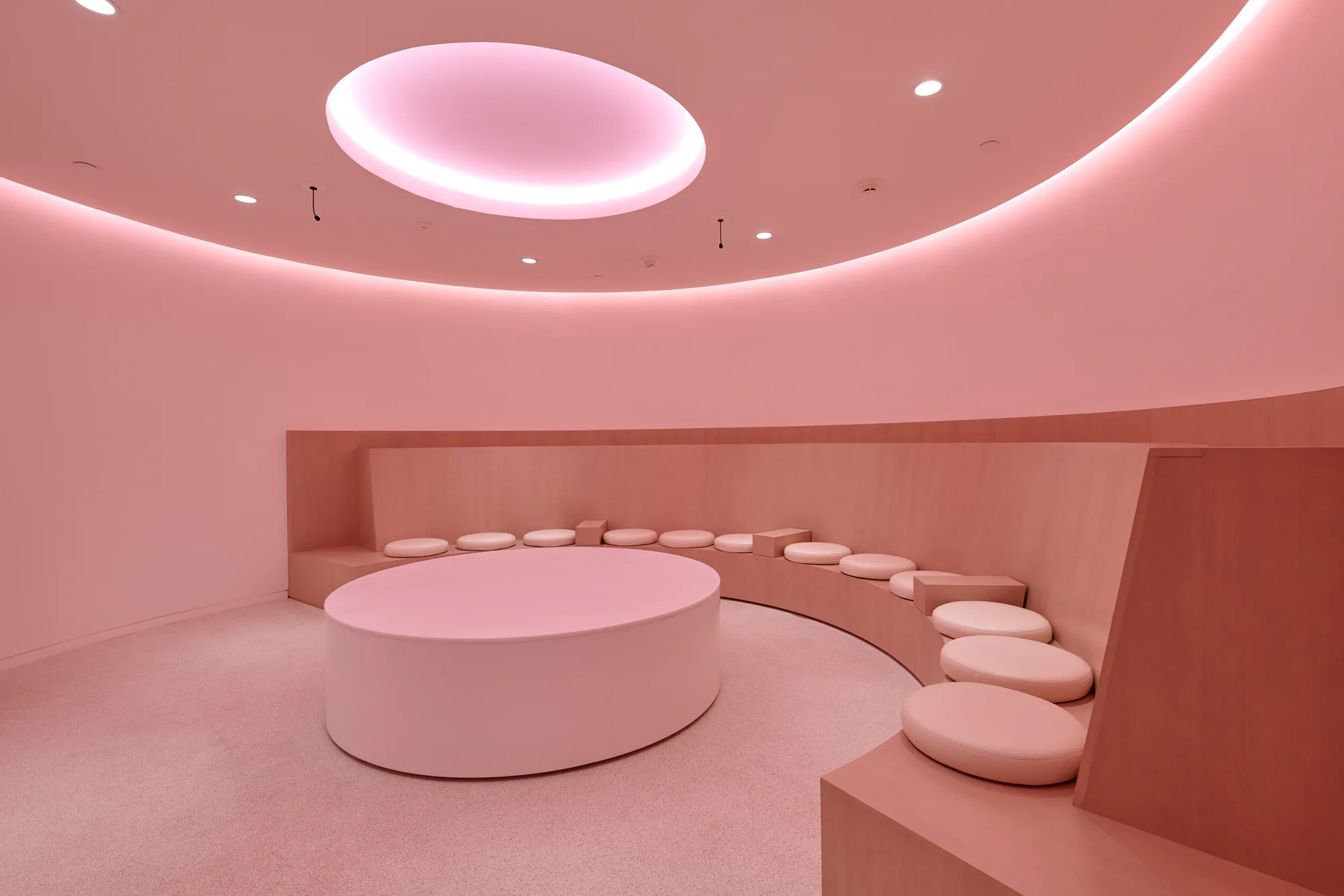 The Collaboration Room washed in pink light.