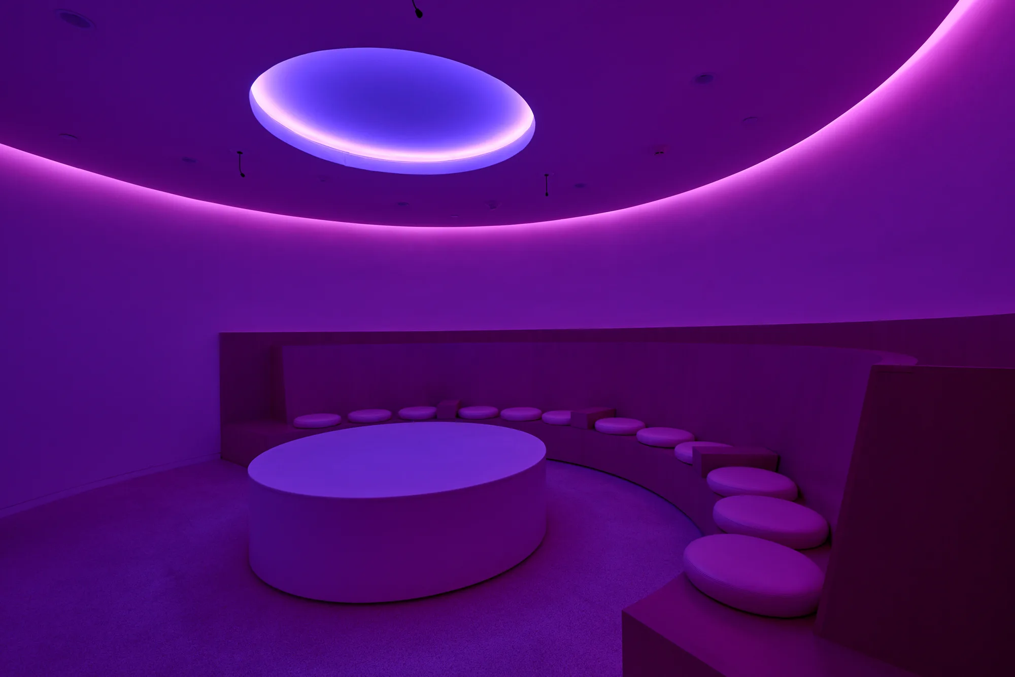 The Collaboration Room washed in violet light.