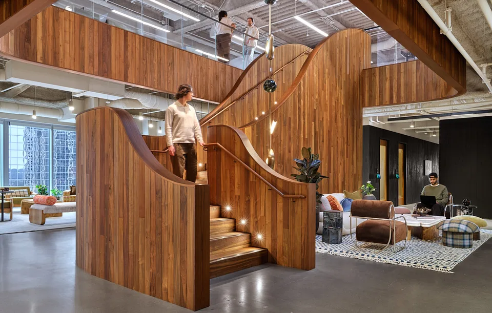 People on the Bellevue stair with lounge seating below.