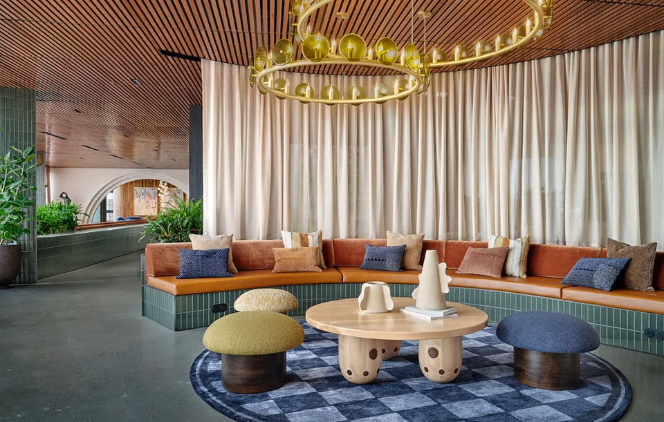 Lounge seating and planters seen through a concrete arch at Bellevue.