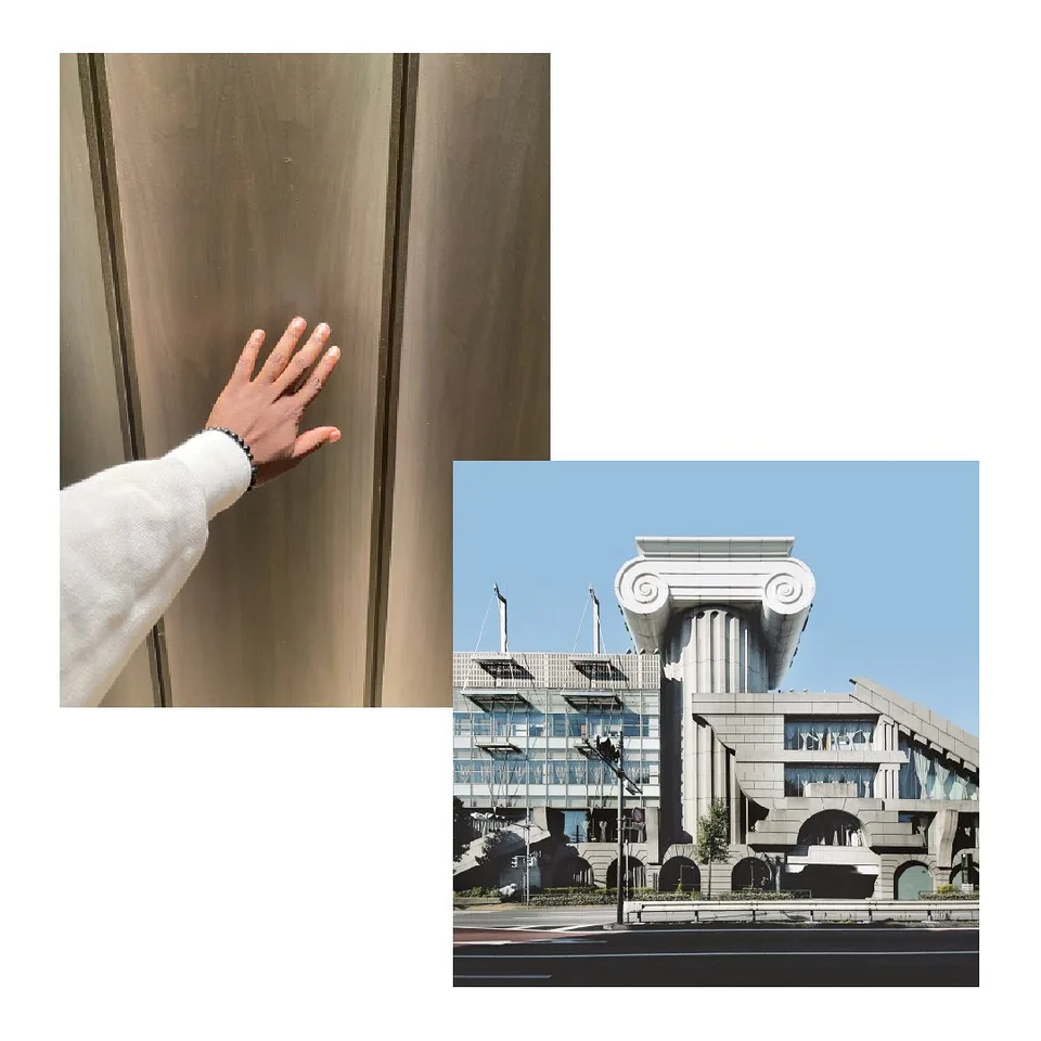 A hand resting on a warm timber panel, beside a photograph of a building crowned with a large classical capital.